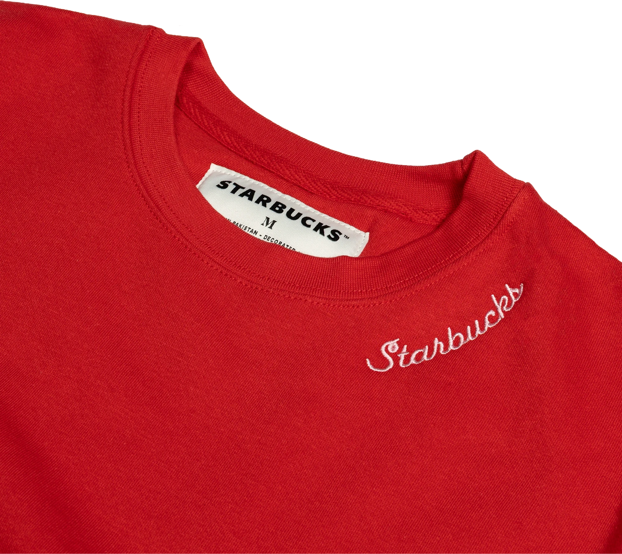 Close-up of white script embroidery and a woven Starbucks neck label on a red crewneck.