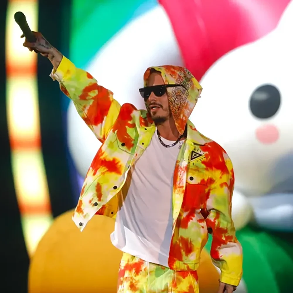 Colorful Guess and J. Balvin Arcoiris apparel arranged as a layered wardrobe collection.