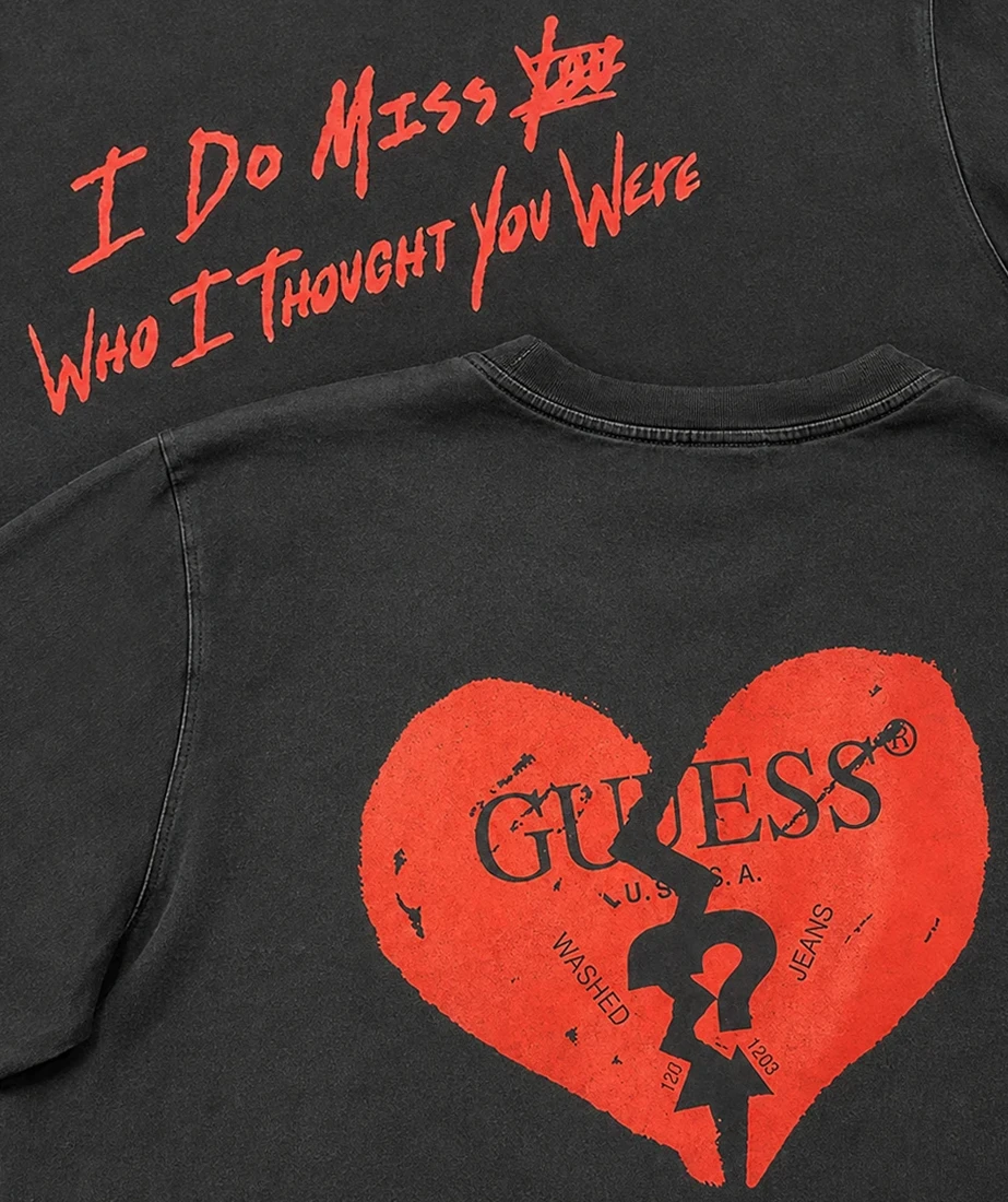 Two black Guess and Trippie Redd shirts with red broken-heart graphics and handwritten text.